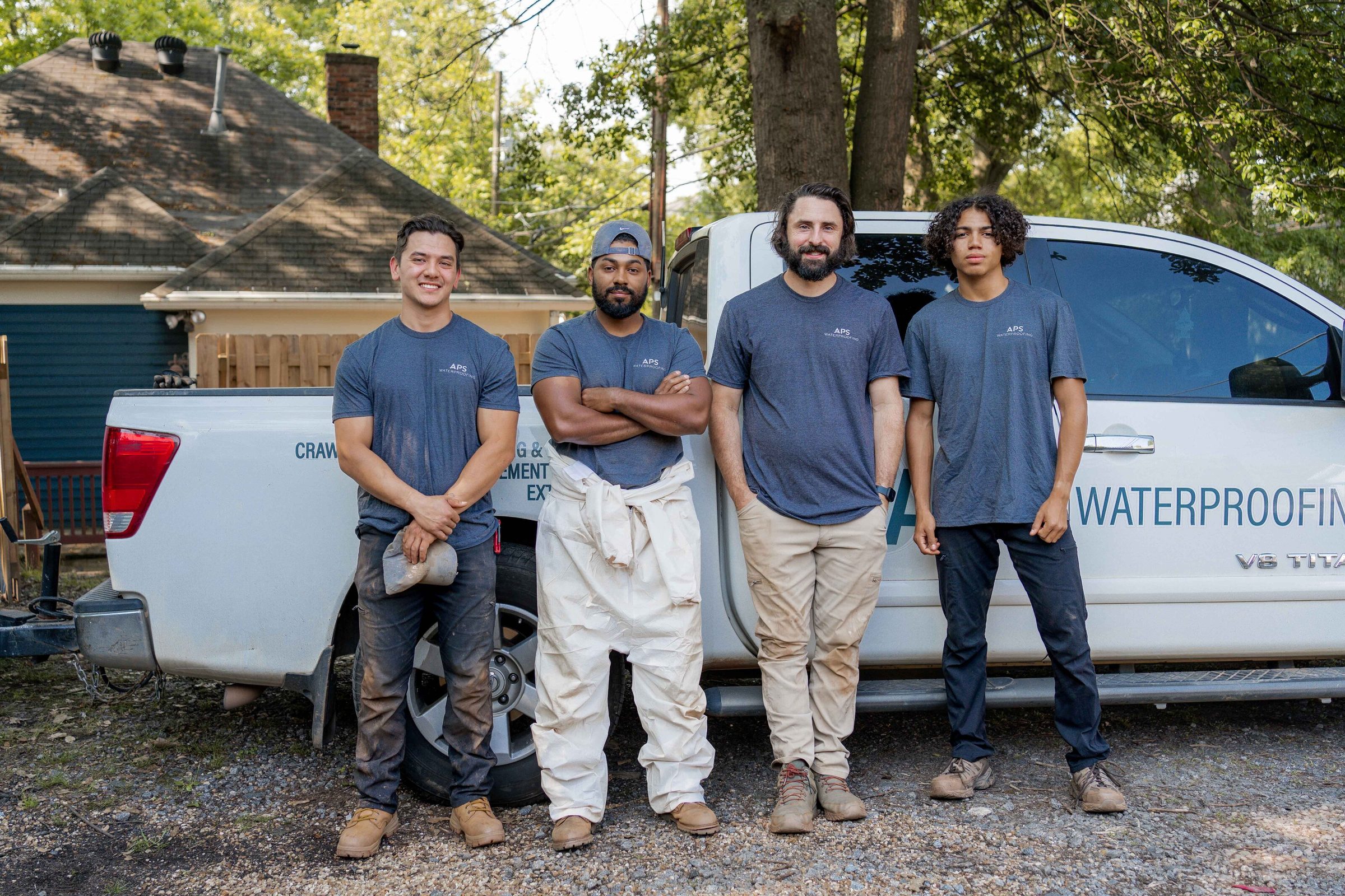 APS Waterproofing team in front of the company truck